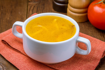 Chicken soup bouillon in a plate