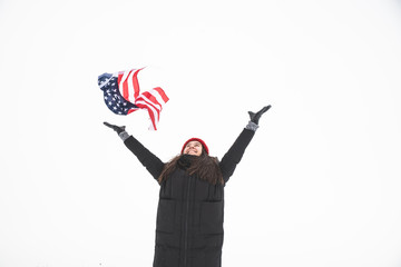 woman catch usa flag. winter time