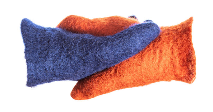 top view of handshake of blue and orange gloves