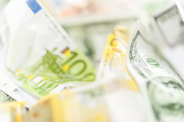 Fake dollars and euro crumpled money background