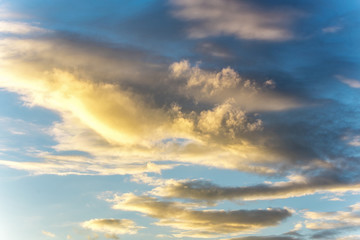 Naklejka na ściany i meble Bright sunset on the background of cloudy sky.