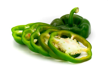 Green bell pepper slices isolated on white background.