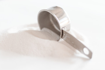 laundry soap spilling over a scoop