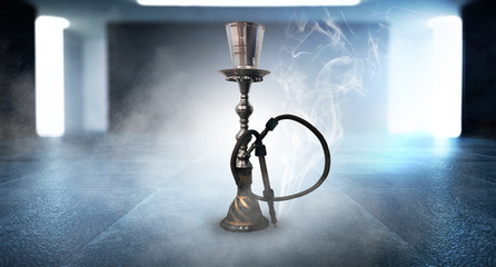Naklejka premium Hookah smoking on the background of an empty grunge wall, neon light, smoke, smog