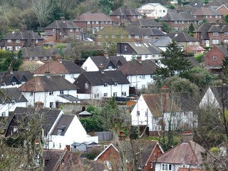 Fototapeta premium View across roof tops in the village of Chorleywood, Hertfordshire, UK