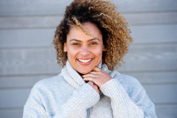 Close up smiling african american woman in warm sweater