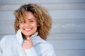Close up beautiful african american woman smiling in warm sweater