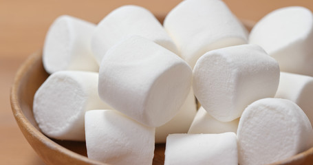 White cotton candy on wooden plate