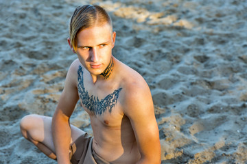 guy in loincloth on the background of sand