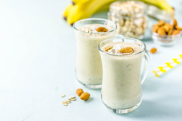 Vanilla cinnamon almond smoothie with coconut flakes. Selective focus, space for text.
