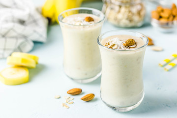Vanilla cinnamon almond smoothie with coconut flakes. Selective focus, space for text.
