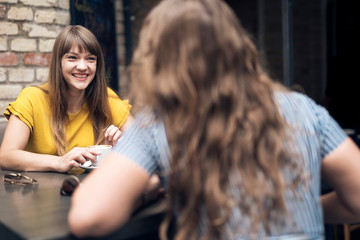 Relaxing women enjoying coffee together