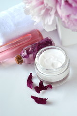 Beauty luxury Spa skincare and creams with pink peonies - cosmetic cream and flower