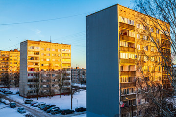 Soviet block houses lit by the morning sun at winter  