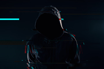 Hooded computer hacker with glitch effect