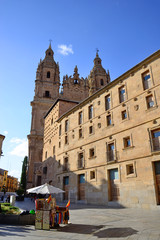 Obraz premium Salamanca, Spain - November 15, 2018: Church of the Holy Spirit (Clerecía) and Casa de las Conchas.