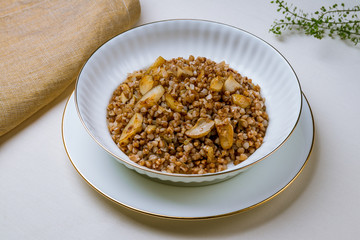 Fried buckwheat porridge with onions and mushrooms