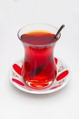 One cup of tea over white background.