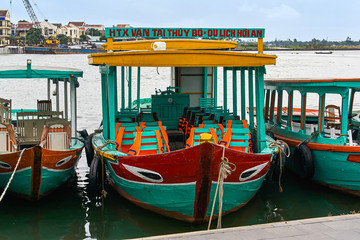 Fototapeta na wymiar HOI AN, VIETNAM - NOVEMBER 2, 2018: Cruise boat on the river