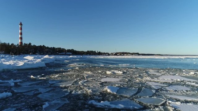 Lighthouse in winter. Aerial video shooting