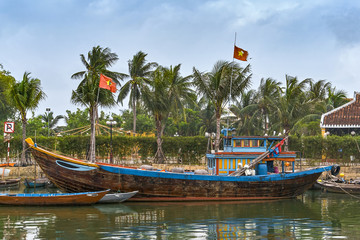 Fototapeta na wymiar Fisherman's boat on the river in Hoi An, Vietnam