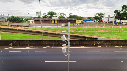 Traffic radar with speed enforcement camera in a highway.