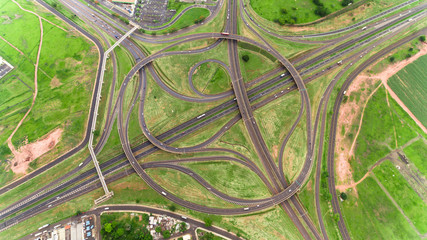 Flyover the complex road junction. Sunny day. Modern Brazil.