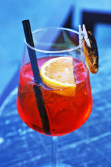 glass of aperol spritz cocktail - champagne with fresh orange juice on table