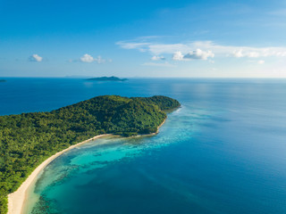 Naklejka na ściany i meble Aerial view of tropical beach on island Ditaytayan. Beautiful tropical island with white sandy beach, palm trees and green hills. Travel tropical concept. Palawan, Philippines
