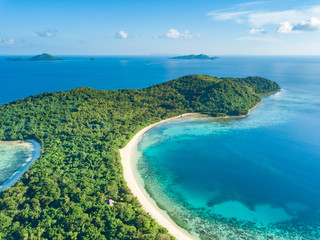 Aerial view of tropical  beach on island Ditaytayan. Beautiful tropical island with white sandy beach, palm trees and green hills. Travel tropical concept. Palawan, Philippines