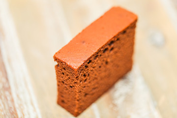 Delicious chocolate cake on plate on table on light background - Image