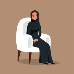 Young arab girl sitting in comfortable armchair. Muslim business woman wearing hijab working at home or in office. Colored vector illustration in flat cartoon style.