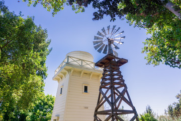 Old wind turbine and wooden water tower, Rengstorff house, Shoreline Lake and Park, Mountain View,...