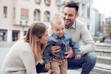 Happy family having fun in the city