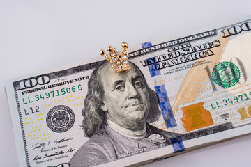  American 100 dollar banknotes  and a  crown