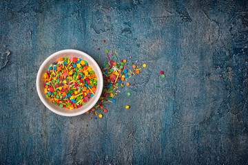 Top view on bright colorful sugar sprinkles or confetti as baking decor