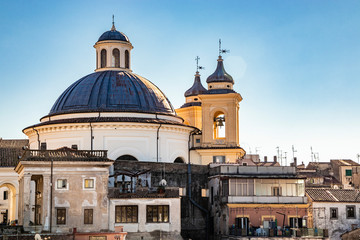 the church of Santa Maria Assunta, in the monumental Piazza di Corte, by Gian Lorenzo Bernini and the Chigi family. The dome and the bell tower with the cross. Ariccia, Castelli Romani, Lazio, Italy.