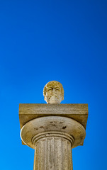 Travertine column with sculpture in memory of Giuseppe Mazzini, in the homonymous square with panoramic terrace. Ariccia, Castelli Romani, Lazio, Italy.