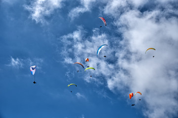 Flying on a parachute in the blue sky