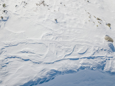 Aerial view of ski tracks in alpine region