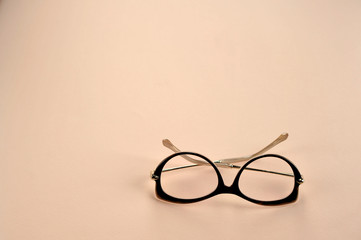 Women's glasses for reading. Light background. View from above. Free space to place text.