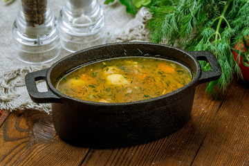 Fish soup on white plate