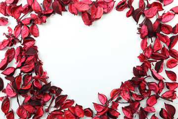 Valentine's Day heart made of red roses frame on isolated white background.