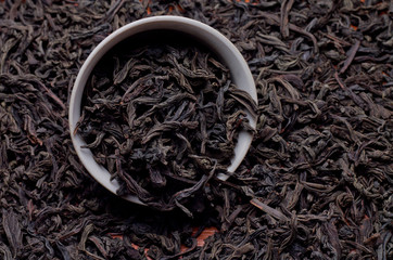Fototapety  czarna herbata liściasta jako tło do prezentacji