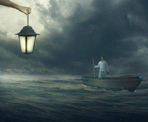 Man in Boat is Looking at God hand with Candelabra that Shows Him a Way
