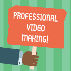 Writing note showing Professional Video Making. Business photo showcasing Filmmaking Images digitally recorded by an expert Hu analysis Hand Holding Colored Placard with Stick Text Space