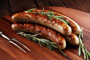 Grilled sausages with spices on a wooden table - Home-made Pork Sausages