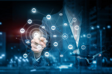 A businesswoman touching the button of networking connections scheme.