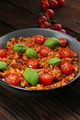 risotto with tomatoes, fresh herbs and parmesan cheese.