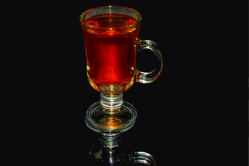 a glass of tea on a high leg